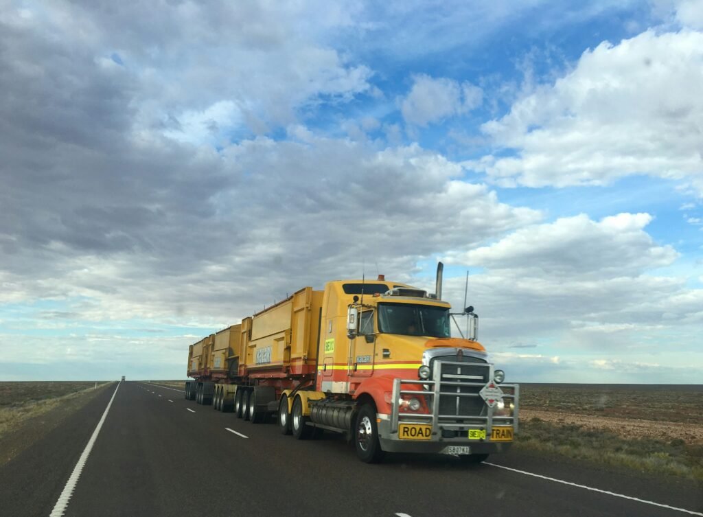 Road train hauling on an outback Australian highway, the kind of truck a subbie finances with a truck loan without full financials