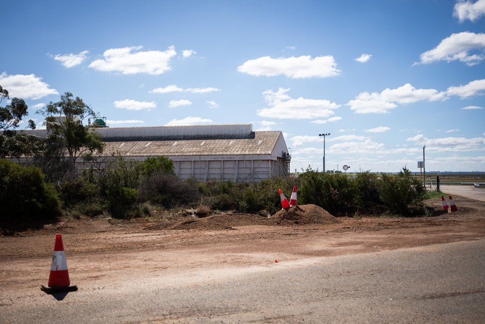 arge commercial shed on red dirt in regional Australia, the kind of property where your commercial property deposit question starts