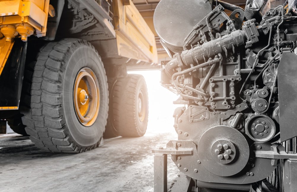 Mining haul truck and heavy diesel engine in a workshop, the kind of gear WA businesses fund with equipment finance