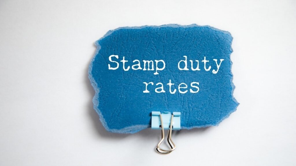 he words Stamp duty rates on torn blue paper, illustrating WA stamp duty for home buyers